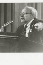 Arthur Kinay testifies at a special congressional briefing at the Justice Department. The hearing was part of a series of events organized by the National Anti-Klan Network, an organization founded by the Southern Christian Leadership Conference. [Note: Caption from page 67 in the June-July 1981 SCLC Magazine issue reads: "Professor Arthur Kinay of Rutgers University, says the president and attorney general must recognize the rise of the Klan as an emergency situation, and institute national federal injunctive actions against Klan groups." See http://hdl.handle.net/20.500.12322/auc.199:07018.]