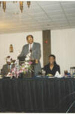 Dr. Henry Whelchel presents a speech at a banquette dinner.