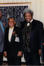 George Foreman, Joseph E. Lowery, Don King, and an unidentified man pose for a photo at the 18th Annual SCLC/W.O.M.E.N. Drum Major for Justice Awards dinner.