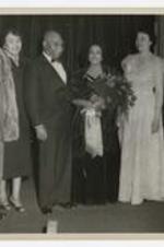 Camilla Williams stands with a group of people. Written on verso: Camilla Williams concert, L to R Rev. Samuel Giles, Dr. Billings or Dr. Hightower, Miss Camilla Williams, Mrs. Josephine Murphy, ca.1950s.