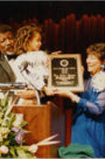 Joseph and Evelyn Lowery are shown presenting a Drum Major for Justice Award to Miss Raven-Symone who accepts the award with the help of actor Hal Williams.