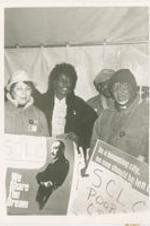 Southern Christian Leadership Conference President Joseph E. Lowery (right) joins his wife Evelyn (at left) and other Atlantans for an all night vigil held for housing, jobs, and healthcare. More information about the vigil can be found on pages 25-29 of the May-June 1988 SCLC Magazine: http://hdl.handle.net/20.500.12322/auc.199:07093.