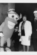 An unidentified man, Izzy (the 1996 Atlanta Olympics mascot), Raven-Symone, Evelyn G. Lowery, and Mayor Maynard Jackson are shown posing for a picture during a SCLC/W.O.M.E.N. Christmas party for the children of Atlanta.