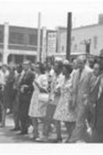 An unidentified man, Mayor Sam Massell, Senator George McGovern, Juanita Abernathy, Ralph Abernathy, Coretta Scott King, Leonard Woodcock, Joseph Lowery, Evelyn Lowery, and other unidentified people make up the front line of the March Against Repression. Written on accompanying document: Front line of March, Mayor Sam Massell-Sen. McGovern, Mrs. Abernathy and Husband.