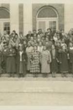 A group portrait of people at the Jeanes conference. Written on recto: April 2-4, 1936