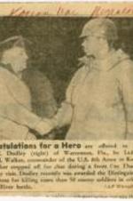 "Congratulations For a Hero", picture and caption about Negro soldier Arthur C. Dudley being congratulated for his Distinguished Service Cross Award.