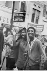 LeMoyne-Owen College students are shown marching and clapping down the streets of Memphis, Tennessee.