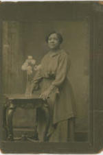 A portrait photo of Mamie A.R. Camphor, a Methodist missionary to Liberia and wife of Alexander P. Camphor. Written on verso: Ms. A.P. Camphor, 31 Webster Place, Orange, N.J.