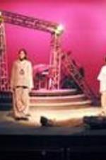 View of actors on stage during a performance of Antigone.