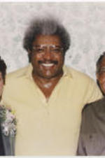 Evelyn G. Lowery, Don King, and Joseph E. Lowery pose for a photo.