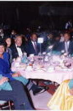 A group sits at a banquet table at the Atlanta Student Movement 20th anniversary event.