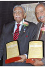 Joseph E. Lowery and U.S. Representative John Conyers hold their awards as they pose for a photo at the Stand Up &amp; Act Awards.