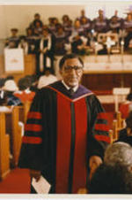 Joseph E. Lowery standing in front of a choir and congregation in a church.