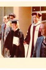 President Hugh Gloster walking with First Lady, Rosalynn Carter. Written on verso: Commencement incl. First Lady Rosalynn Carter.