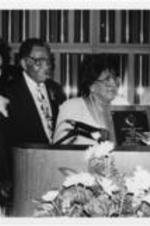 Joseph and Evelyn Lowery and an unidentified woman are shown presenting the Drum Major for Justice Award in Communications to Ethel L. Payne during the 12th Annual Drum Major for Justice Awards dinner. Written on verso: 4-6-91