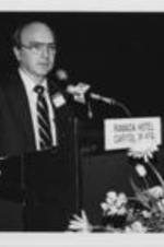Dr. Walter Dowdle is shown speaking at the 1st National Conference on AIDS and the Black Community. For more details on the conference, see pages 42-45 of the August-September 1986 SCLC Magazine: http://hdl.handle.net/20.500.12322/auc.199:07030. Written on verso: Dr. Walter Dowdle.