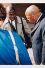U.S. Representative John Lewis and Evelyn G. Lowery (back to the camera) speak to a tour attendee.