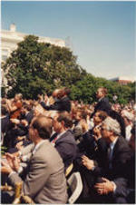 Joseph E. Lowery (center) is shown clapping with others on the lawn of the White House during the ceremony for the signing of the Israel-Palestinian Agreement.