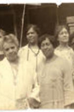 Mrs. Lugenia Burns Hope and Interracial Women's Group on steps of a porch, International Council of Women of Darker Races, circa 1930. Written on verso: Back row: second left, Mrs. Moton, third left, Mrs. Hope. Mrs. Bethune, first row, first from right.