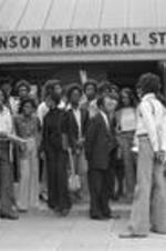 John R. Lewis stands and talks with students outside the Alma C. Hanson Memorial Student Center in Memphis, Tennessee.