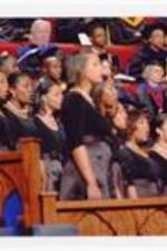 View of faculty and glee club singing at commencement.