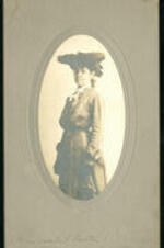 Portrait of Isabel Carter standing with dress hat.
