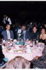 A group sits at a banquet table at the Atlanta Student Movement 20th anniversary event.