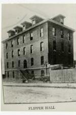 A brick building. Written on verso "Original Campus, Joseph Simeon Flipper Hall".