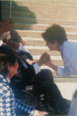 Joseph E. Lowery is shown holding hands with Nancy Pelosi during a 50th Anniversary of the March on Washington event. Evelyn G. Lowery looks on.