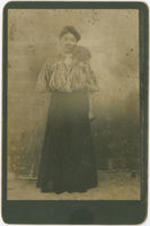 Portrait of an unidentified woman standing.