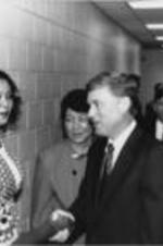 Vice President Dan Quayle is shown greeting an individual during his tour of the SCLC/WOMEN Learning Center. SCLC/WOMEN leadership members Carolyn Watson and Evelyn G. Lowery (second and third from left) look on.