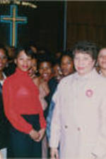 Evelyn G. Lowery is shown standing with Evelyn Occhino (at right, in front) and a group of other women at a Southern Christian Leadership Conference Spring Board meeting held at Grace Temple Baptist Church in Detroit, Michigan.