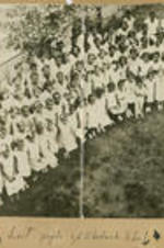 A group of children and teenagers gather in a yard. Written on recto: Last pupils of Chadwick School.
