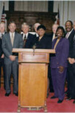 John H. Ruffin, Jr. with Judge Bettieanne Childers Hart and others. Written on verso: Newly sworn-in Judge Bettieanne Childers Hart, Superior Courts of Georgia, Augusta Judicial Circuit with Gov. Zell Miller and Augusta, Georgia colleagues