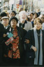 Kris Kristofferson (second from left), Evelyn G. Lowery (second from right), and John Lewis (first from right) march with others in a "Black Youth Vote" event in Atlanta, Georgia. Written on verso: kris kristofferson