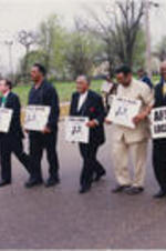 Joseph E. Lowery is shown marching with an "I Am A Man" sign alongside Jesse Jackson and others at a Covington Pike Toyota strike in Memphis, Tennessee.