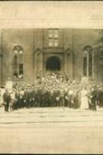 A group stands for a portrait outside of the Central Avenue Methodist Episcopal Church, possibly a church convention.