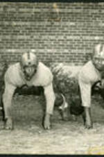 William and Donald Henderson suited up in football uniforms.