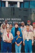 Evelyn G. Lowery poses for a photo with a group of Boy Scouts and troop leaders at the Southern Poverty Law Center's Civil Rights Memorial Center.