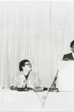 Southern Christian Leadership Conference President Joseph E. Lowery delivers the keynote address at an Anti-Klan Conference held in Atlanta, Georgia. More details about the conference can be found on pages 50-51 of the January-February 1980 SCLC Magazine: http://hdl.handle.net/20.500.12322/auc.199:07011. Written on verso: Joseph E. Lowery delivered keynote address at Anti-Klan Conference in Atlanta during the month of December. The SCLC President said a united effort is needed to bring an end to KKK violence and a rising wave of racism. Listening attentively is Ken Chastain, a union organizer who was beaten up by members of the Ku Klux Klan. Note: Duplicate of photo can found at http://hdl.handle.net/20.500.12322/auc.199:02407.