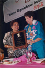 Evelyn G. Lowery is shown presenting the National Convener Award for "Dedicated Service in the Continual Struggle for Peace and Justice" to Ruby Dee during the SCLC/W.O.M.E.N. Luncheon at the 34th Annual Southern Christian Leadership Conference Convention.