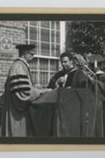 Written on verso: Clark College Commencement Exercises ca. May 1975, Left to right: 1. Dr. Vivian Wilson Henderson- President, 2. Rev. Andrew Young- Rec. an Honorary Doctorate Degree, 3. Dr. Charles Knight- Vice. President.