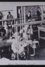 Students conduct experiments in a physics lab. Text from slide presentation: South Atlanta was strengthened by people of good will, of both races, who invested their