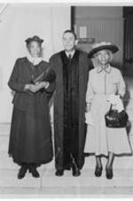 Anna E. Hall standing with unidentified minister and woman (possibly Warner).