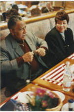 Joseph and Evelyn Lowery sit in a booth at a restaurant in Heidelberg, Germany. The Lowerys were in Heidelberg to attend the NAACP's 13th Annual Martin Luther King, Jr. international commemoration at the University of Heidelberg.