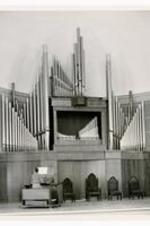 View of an unidentified woman playing the organ in Sisters Chapel.