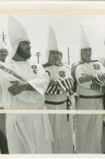 Bill Wilkinson (at center), an Imperial Wizard of the Ku Klux Klan (KKK), stands with other KKK members at a protest in Decatur, Alabama. Written on verso: Wilkerson [sic] and aids