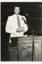 View of a man at a podium.
