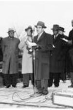 Dr. Harry V. Richardson (at microphone) and Dr. Benjamin E. Mays (right) with other men on stage at the ITC dedication. Written on verso: President Richardson speaking at the service of dedication. Others on platform are: L. to R., Bishop W.R. Wilkes, Rev. M. J. Wynn, Pres. Rufus E. Clement of Atlanta University, Bishop P.R. Shy, Mr. E. C. Miller, architect, and President Benjamin E. Mays.