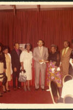 Group portrait of Dr.Vivian Wilson Henderson, president of Clark College, and unidentified men and women during an award ceremony for Clark College, possibly at the Atlanta Marriott.
